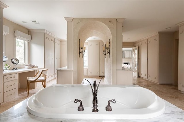 bathroom with tile patterned flooring, vanity, and a bathtub