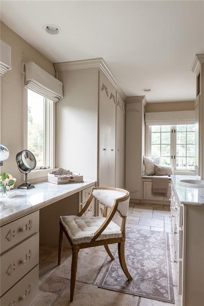 interior space with sink and light tile patterned flooring