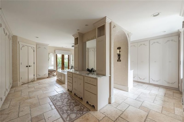 kitchen featuring sink and light tile patterned floors