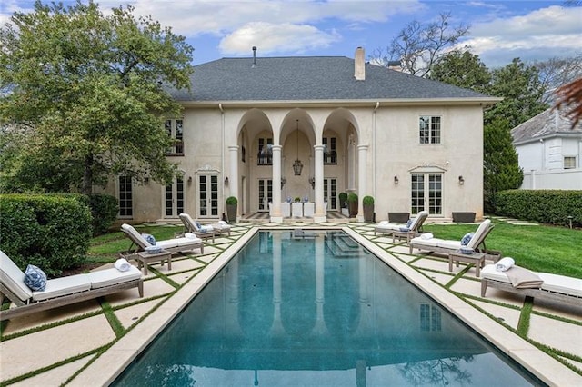 back of house featuring french doors and a patio area