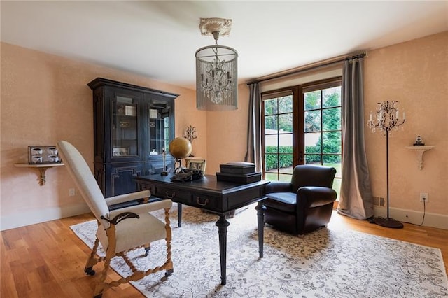 office area featuring light wood-type flooring and french doors