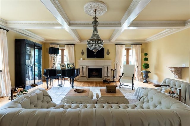 living room featuring a wealth of natural light, light hardwood / wood-style flooring, and coffered ceiling