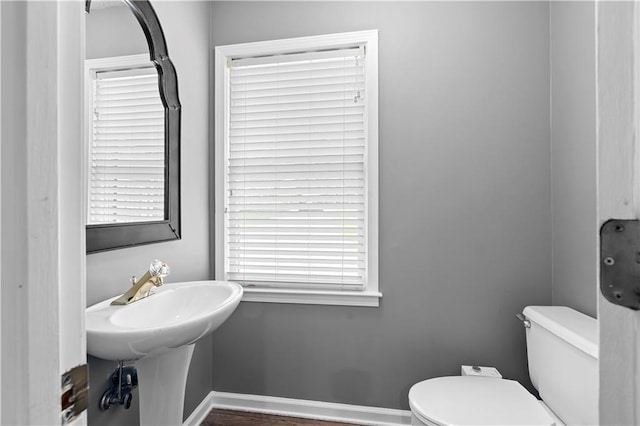 2865 Bryant Ct, Cumming, GA 30040 - bathroom with toilet, baseboards, and wood finished floors