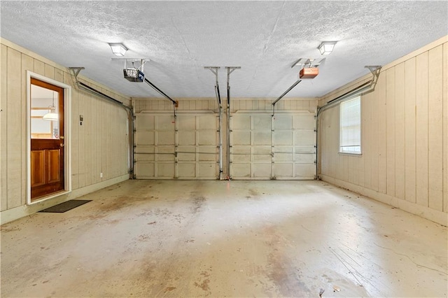 2865 Bryant Ct, Cumming, GA 30040 - garage with a garage door opener and wood walls