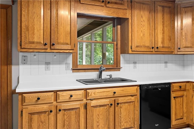 2865 Bryant Ct, Cumming, GA 30040 - kitchen with black dishwasher, a sink, brown cabinets, light countertops, and backsplash