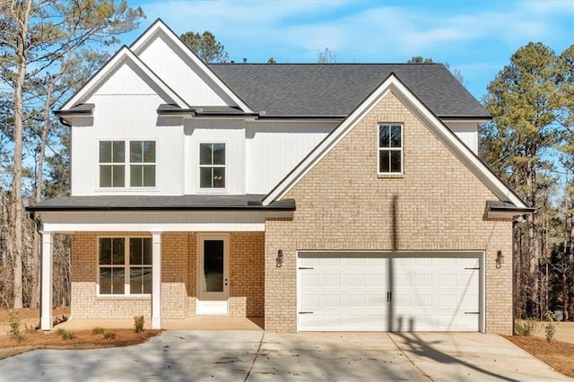 view of front facade featuring a garage and covered porch