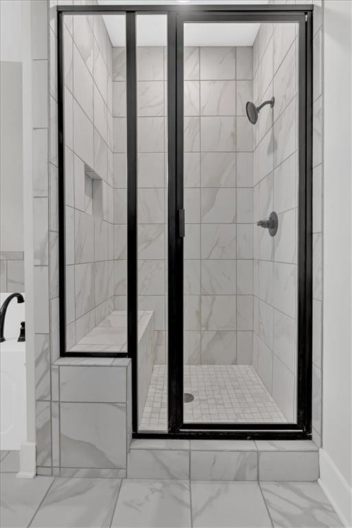 bathroom with a shower with shower door