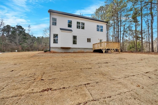 back of property featuring a deck