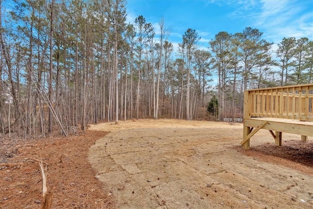 view of yard with a wooden deck