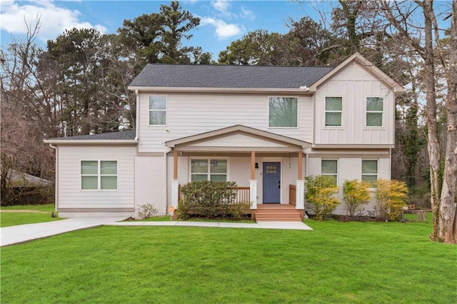 2206 Loring Ct, Decatur, GA 30032 - view of front of house with a porch, a front lawn, and board and batten siding