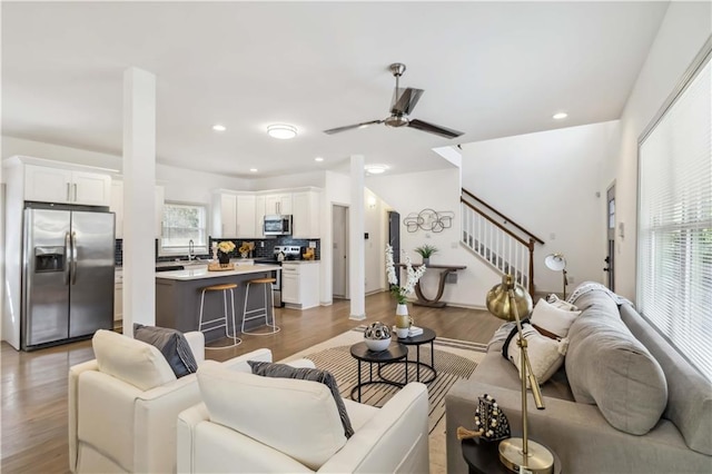 2206 Loring Ct, Decatur, GA 30032 - living area with recessed lighting, ceiling fan, stairway, and wood finished floors