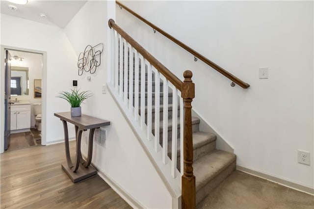 2206 Loring Ct, Decatur, GA 30032 - staircase with wood finished floors and baseboards