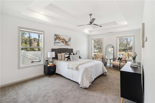 2206 Loring Ct, Decatur, GA 30032 - carpeted bedroom with a raised ceiling, a ceiling fan, and multiple windows