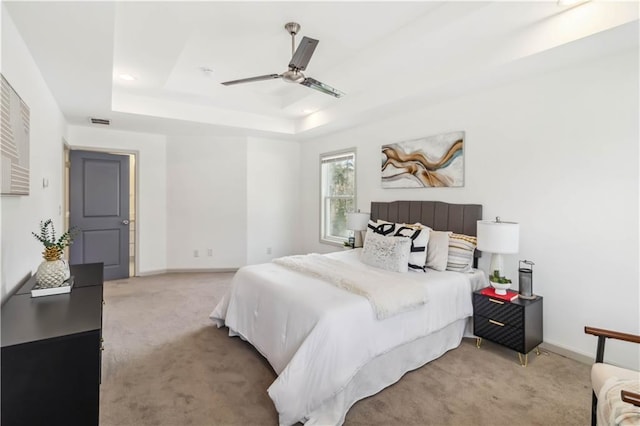 2206 Loring Ct, Decatur, GA 30032 - bedroom with baseboards, a raised ceiling, a ceiling fan, and light colored carpet