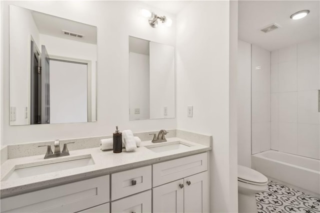 2206 Loring Ct, Decatur, GA 30032 - full bath with visible vents, toilet, double vanity, and a sink