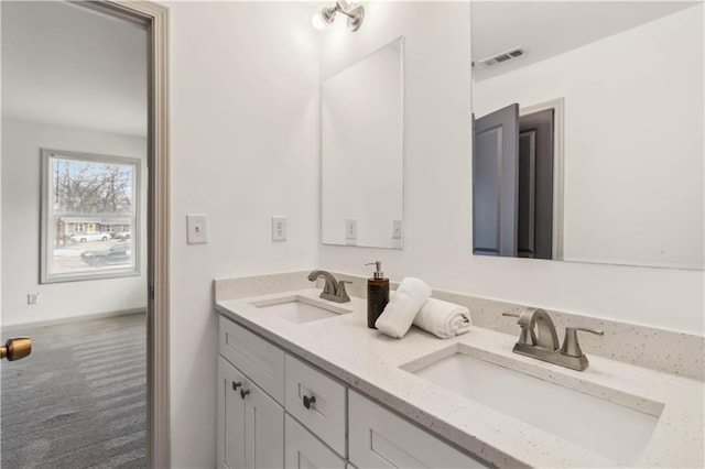 2206 Loring Ct, Decatur, GA 30032 - bathroom featuring double vanity, visible vents, and a sink