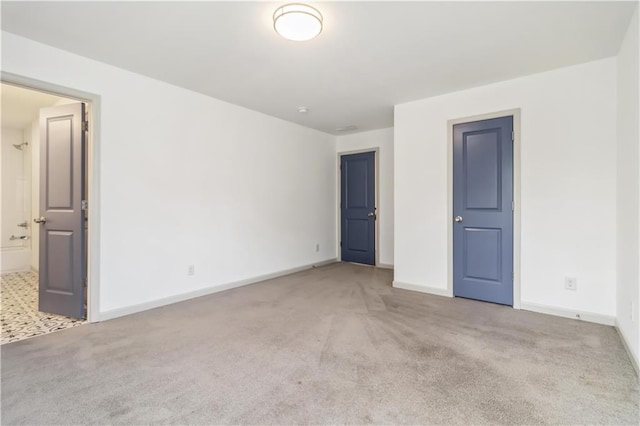 2206 Loring Ct, Decatur, GA 30032 - unfurnished bedroom featuring ensuite bathroom, carpet floors, and baseboards
