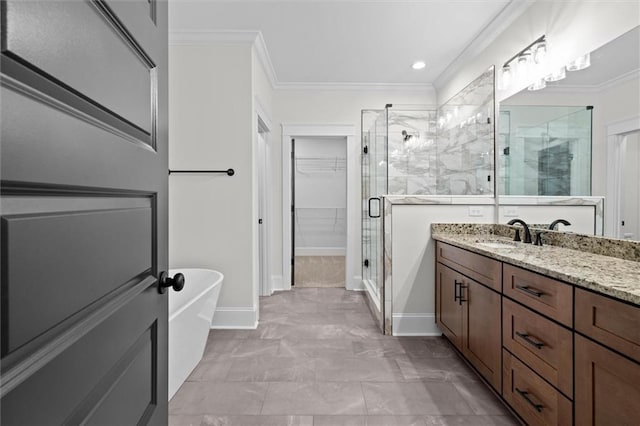 130 W Lake Blvd, Carrollton, GA 30116 - bathroom with a shower stall, vanity, crown molding, a soaking tub, and a spacious closet