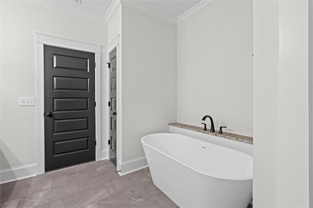 130 W Lake Blvd, Carrollton, GA 30116 - full bath featuring baseboards, a freestanding bath, and ornamental molding