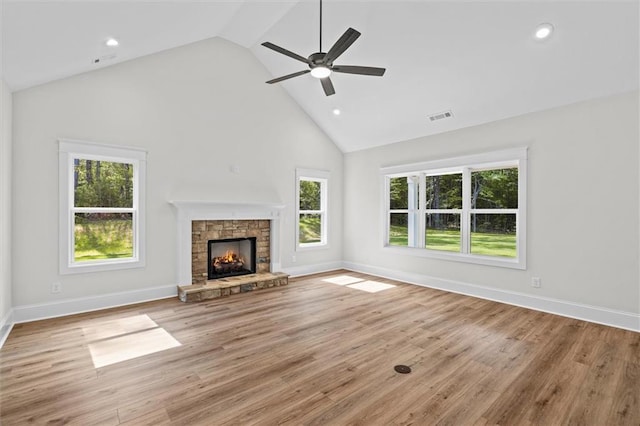 130 W Lake Blvd, Carrollton, GA 30116 - unfurnished living room featuring high vaulted ceiling, a ceiling fan, a fireplace, baseboards, and wood finished floors