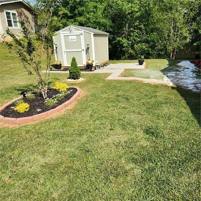 view of yard with a shed and an outbuilding