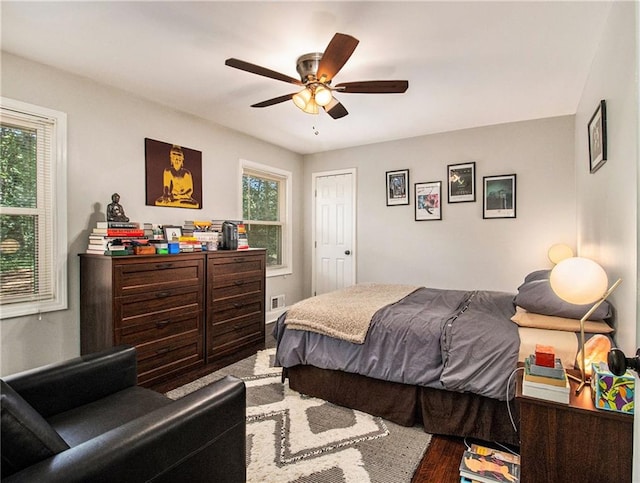 bedroom featuring ceiling fan and hardwood / wood-style flooring