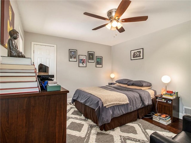 bedroom featuring light hardwood / wood-style floors and ceiling fan