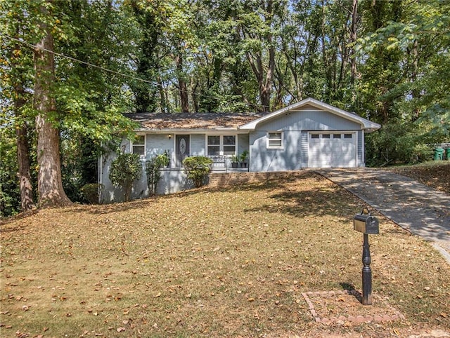 single story home with a front yard and a garage