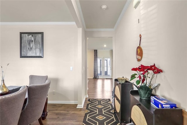 interior space featuring dark wood-type flooring and crown molding