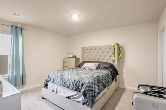 bedroom with light carpet