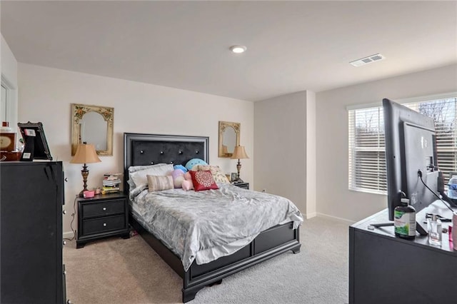 bedroom with light colored carpet