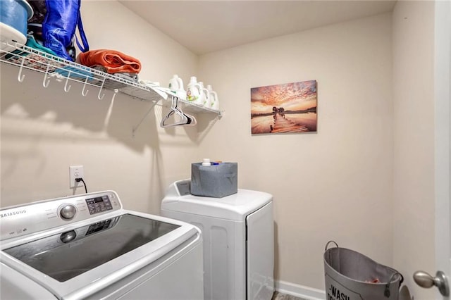 clothes washing area with washer and dryer