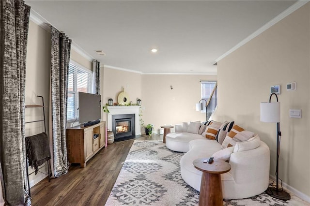 living room with dark hardwood / wood-style floors and ornamental molding