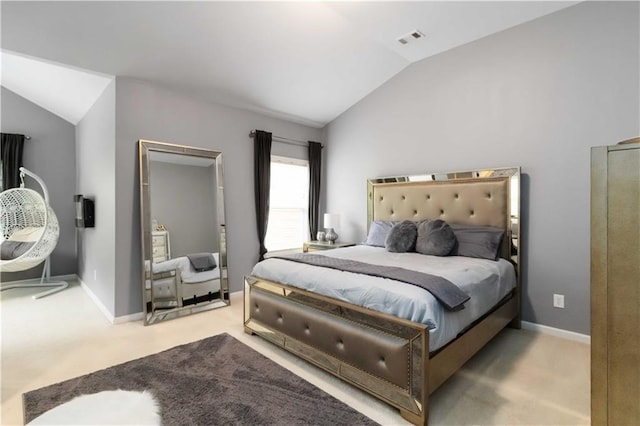 carpeted bedroom featuring vaulted ceiling and baseboards