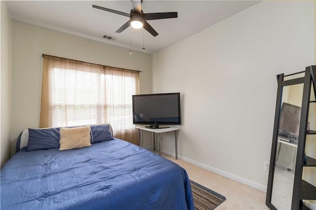 bedroom featuring carpet floors, baseboards, and a ceiling fan