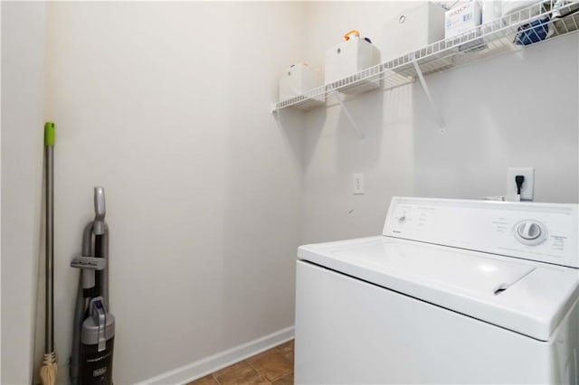 laundry area featuring washer / clothes dryer and baseboards