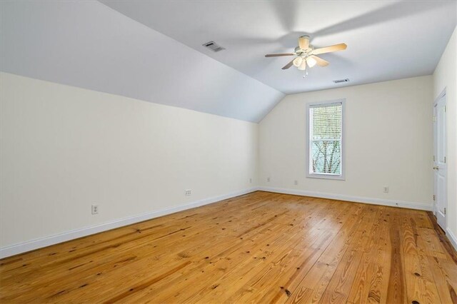 bonus room featuring vaulted ceiling, ceiling fan, and light wood-type flooring