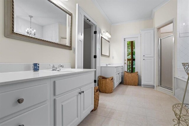 bathroom featuring a chandelier, ornamental molding, vanity, an enclosed shower, and tile patterned floors