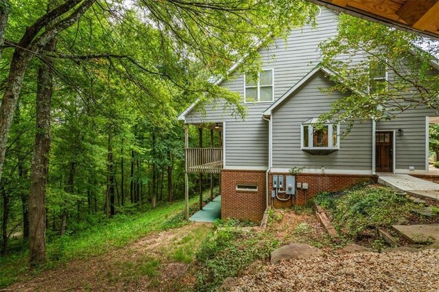 view of side of home featuring a patio area