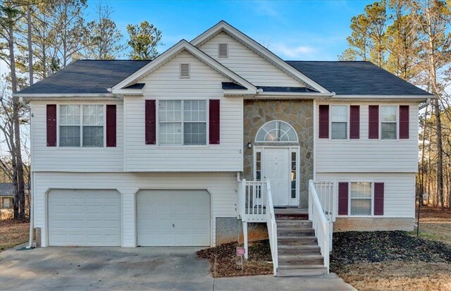 split foyer home featuring a garage