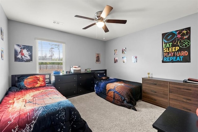 bedroom featuring carpet flooring, visible vents, and a ceiling fan