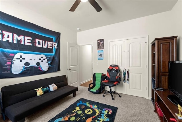 playroom featuring ceiling fan and carpet floors