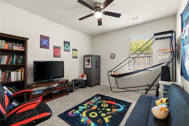 rec room featuring carpet floors, ceiling fan, and visible vents