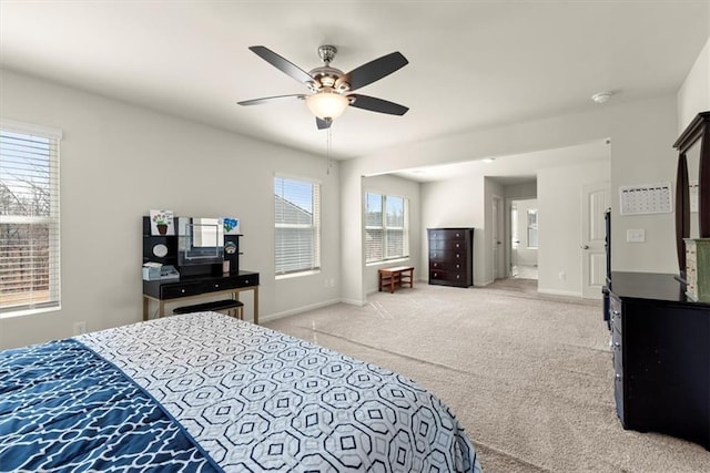 bedroom featuring a ceiling fan, baseboards, and carpet flooring