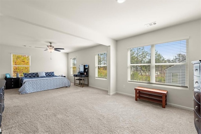 bedroom with carpet, baseboards, visible vents, and ceiling fan