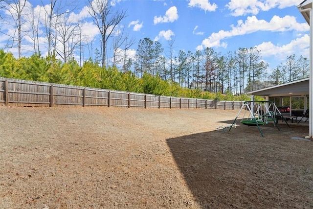 view of yard with a fenced backyard