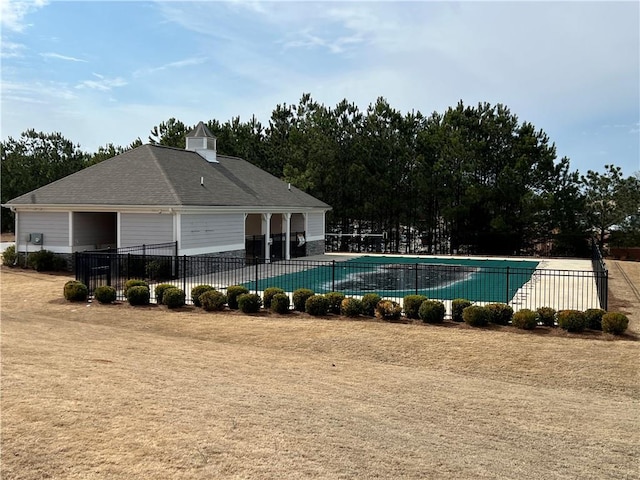 pool featuring a patio and fence