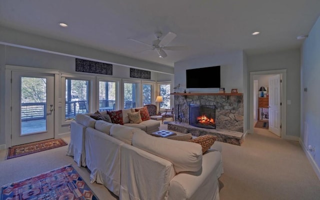 126 Jenkins Cir, Lakemont, GA 30552 - living room with light carpet, a stone fireplace, a ceiling fan, and recessed lighting