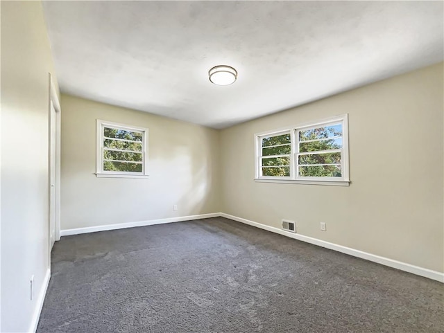 3811 Reynolds Rd, Douglasville, GA 30135 - spare room featuring a wealth of natural light, baseboards, and visible vents