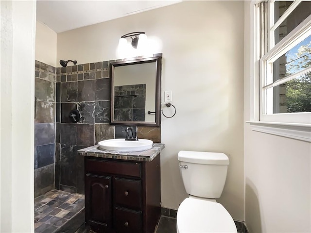 3811 Reynolds Rd, Douglasville, GA 30135 - full bathroom with vanity, toilet, and a tile shower